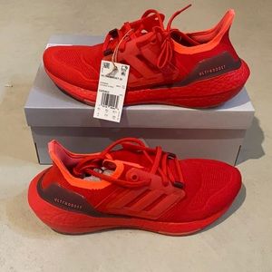 New red adidas ultra boost sneakers
